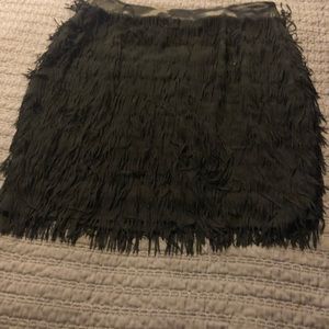 A black fringe holiday skirt